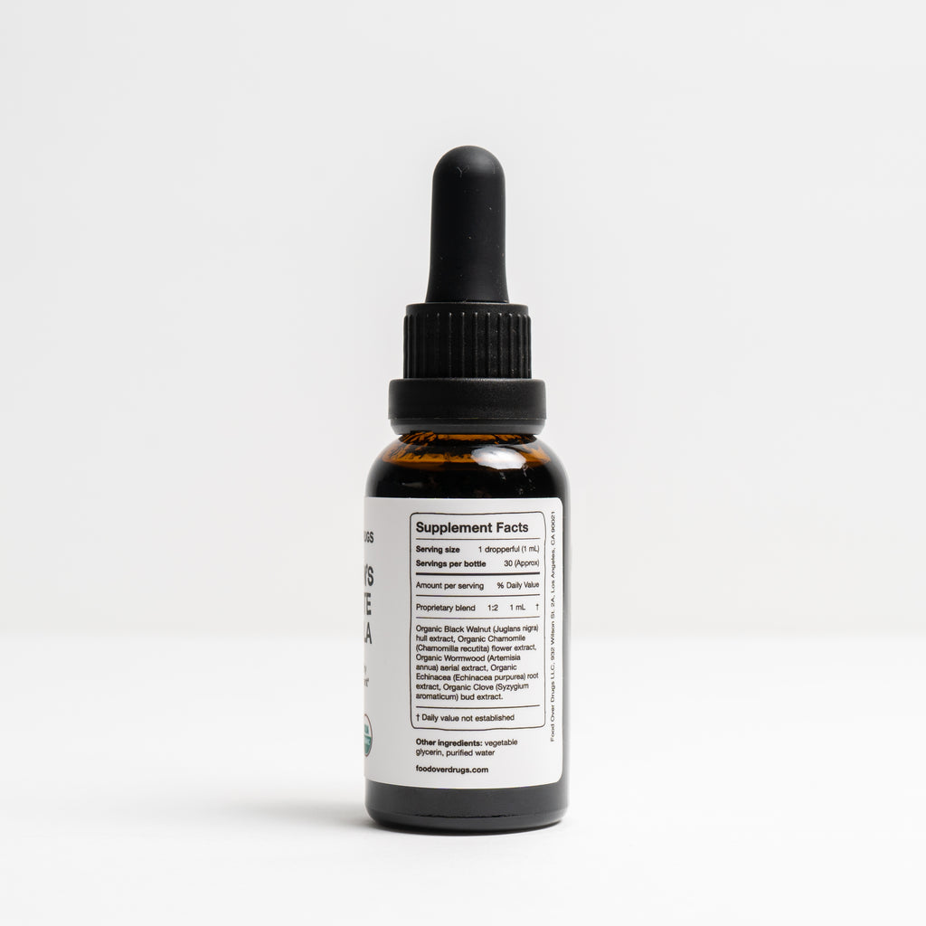 Bottle of 'Children's Parasite Formula' on a white background