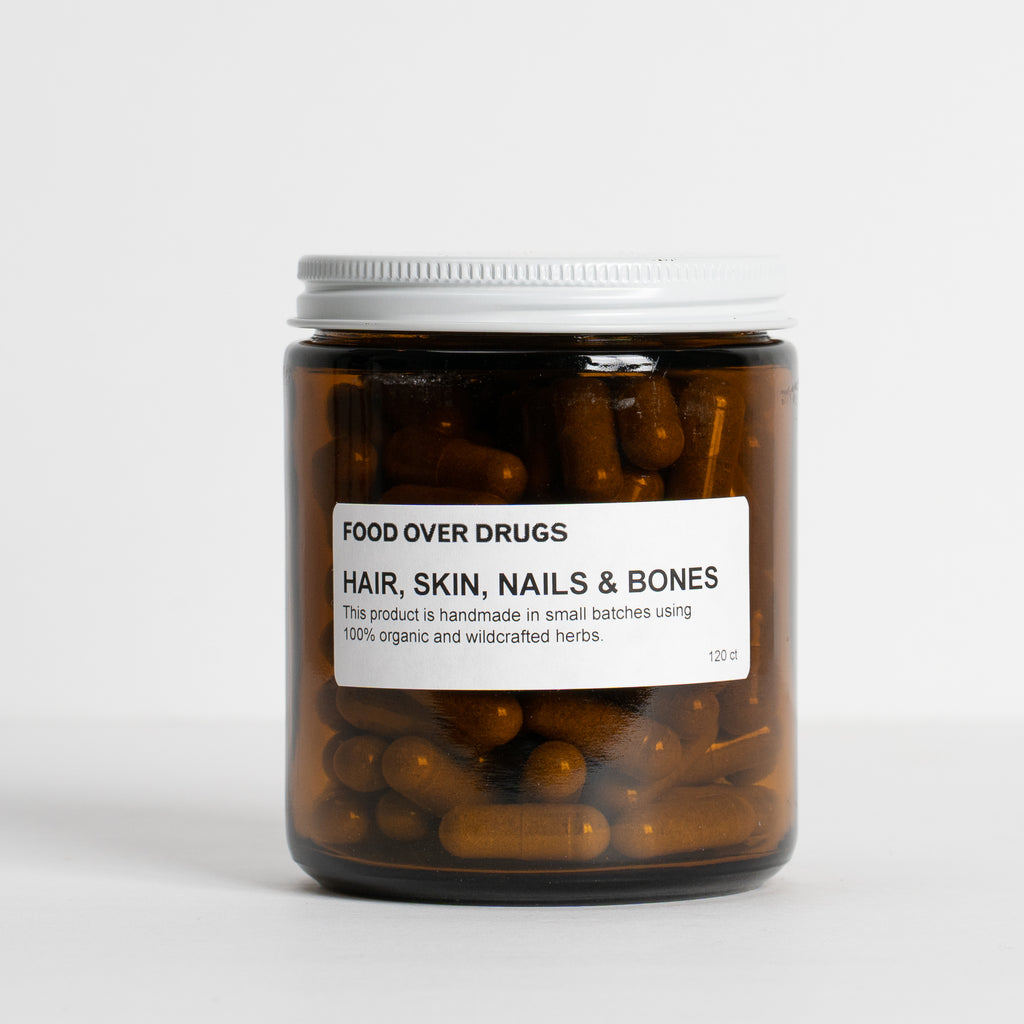 Amber jar of Hair, Skin, Nails & Bones supplement.