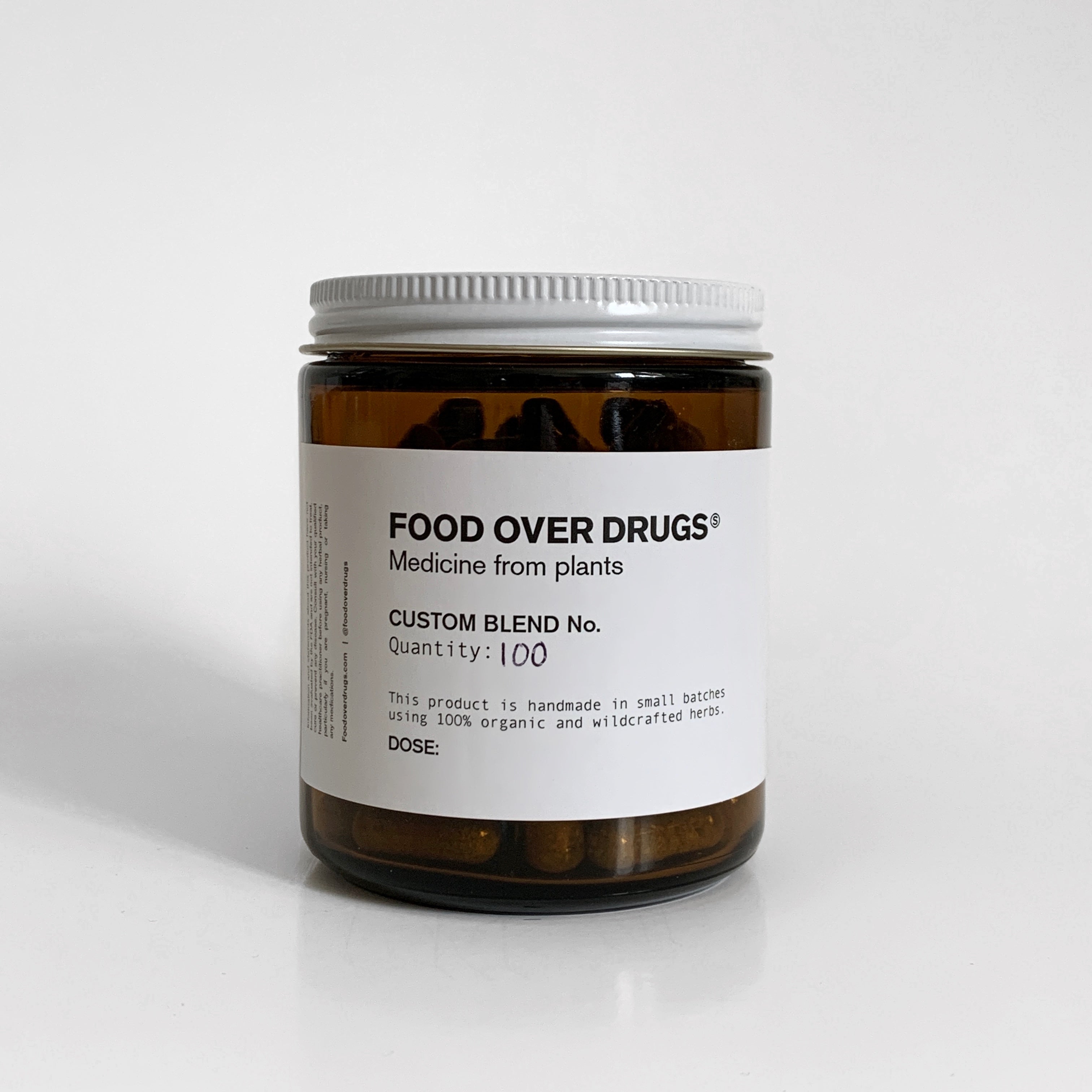 Amber jar labeled Food Over Drugs with custom blend.